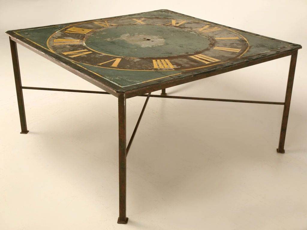 Remarkable antique Continental clock face with remnants of it's original painted finish. Perect utilized indoors or out, this table is a true treasure. Have your friends oohing and aahing at this unique table, having cocktails by the pool, playing