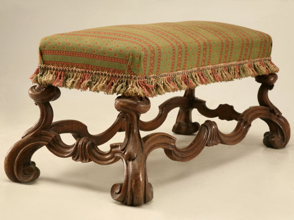 Absolutely exquisite hand carved Italian walnut bench. Breathtaking, this beauty will steal the show. Awesome benches such as this are incredible utilized in entry foyers as a place to remove muddy boots and shoes, as a spectacular statement at the