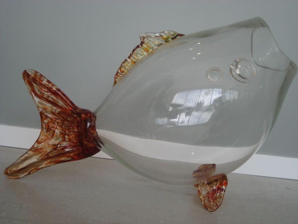 Big big big vintage Blenko glass fish. The body of the fish is clear with amber glass accents on the fins.