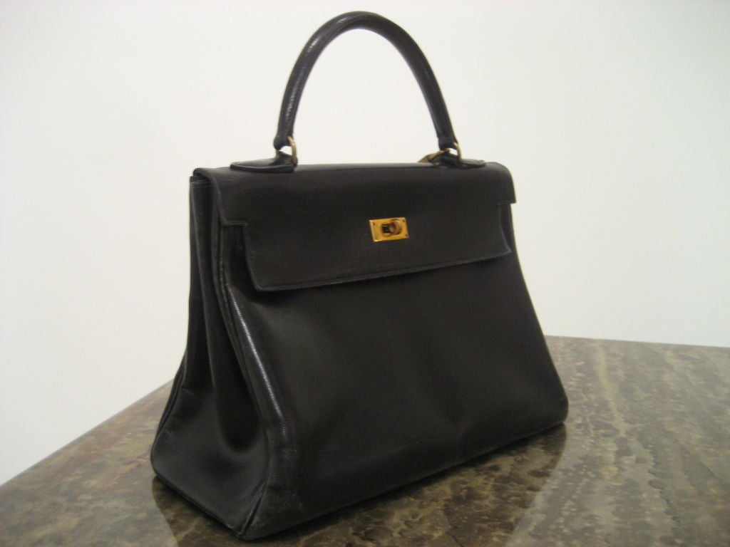 Vintage black leather Hermes genuine Kelly Bag with original lock and key.