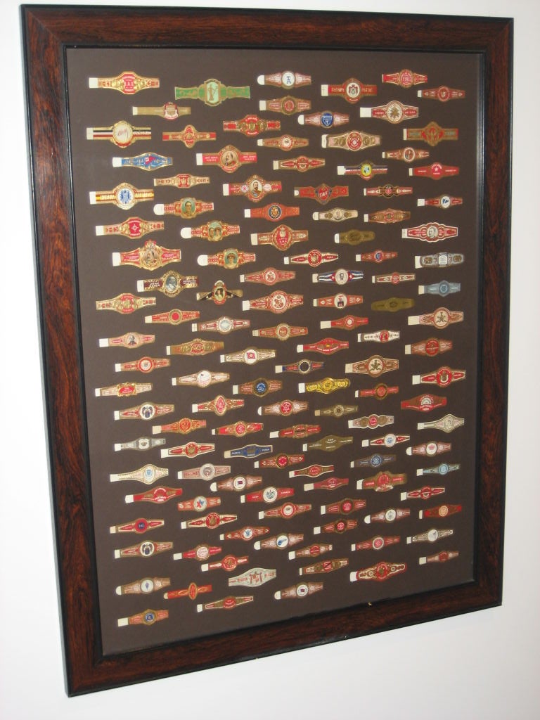 Turn of the century composition of vintage cuban cigar labels. This whimsical folk art piece can be hung horizontally or vertically.