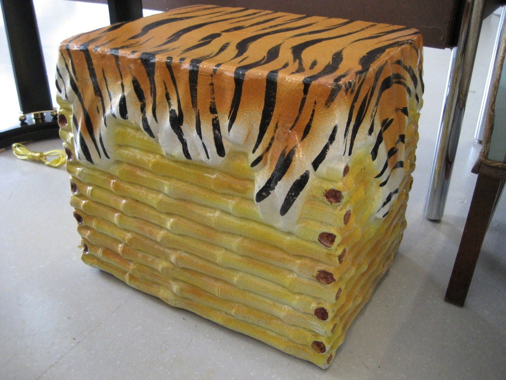 Glazed ceramic garden stool with tiger and bamboo motif.