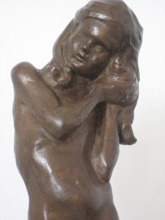 Bronze sculpture of a girl holding a shell to her ear by listed important Ameerican artist Beatrice Fenton. Beatrice Fenton taught at Moore College of Art in Philadelphia and is recognized for her figurative bronzes in collections worldwide.