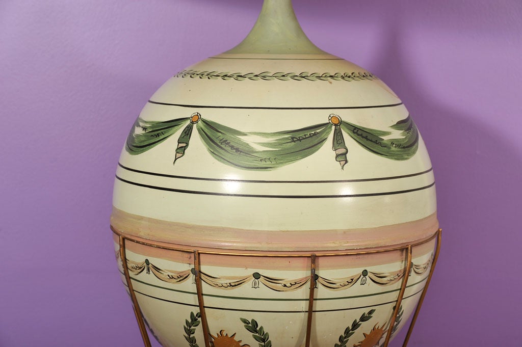 A French table lamp with base in the form of a tole peinte hot air balloon with hand painted and transfer decoration with square base.