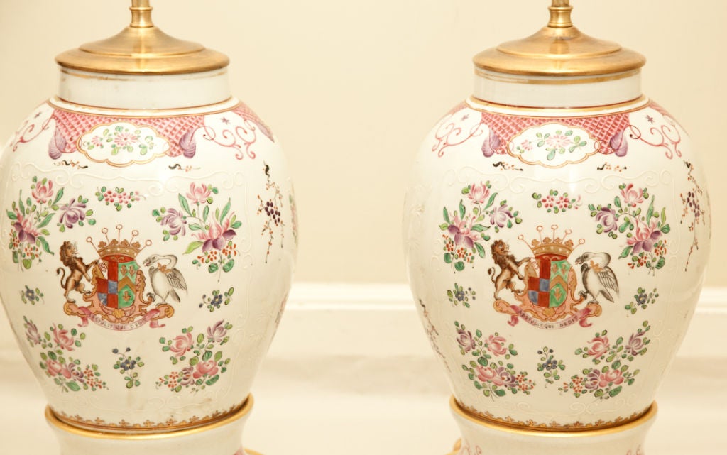A pair of French Samson porcelain vases with Chinese export armorial design in the famille Rose design. Now mounted as lamps with custom made turned wooden bases having hand painted decoration.
