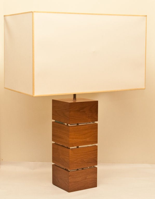 A pair of table lamps with bases in the form of four stacked cubes of walnut with perspex (lucite) between each section. With silver nickel plated fittings signed 
