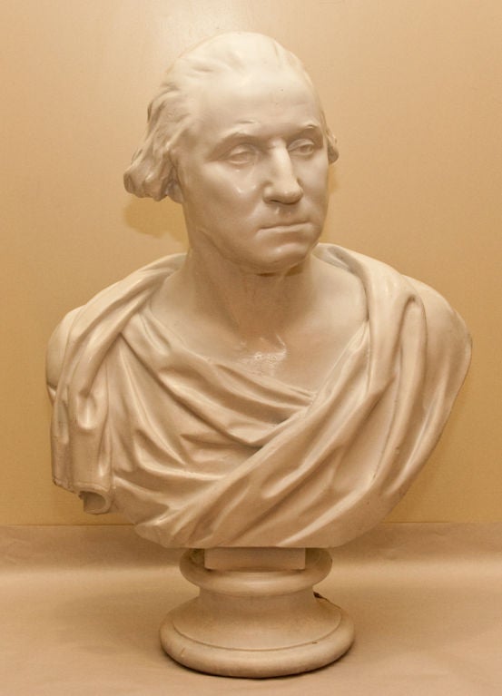 A plaster bust of George Washington after the original sculpted marble likeness by Houdon (Jean Antoine Houdon March 25, 1741–July 15, 1828).