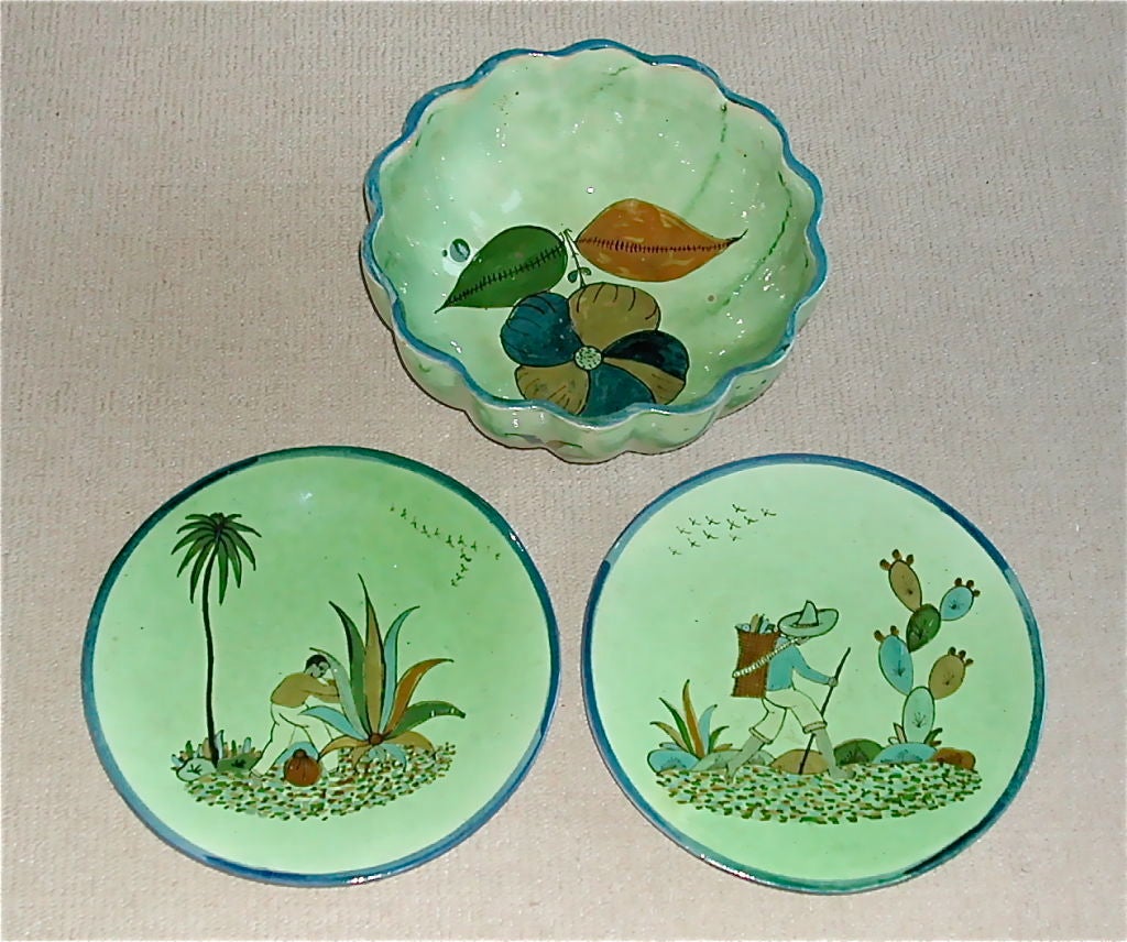 Glazed bowl and two dinner plates hand painted in the detailed style of 