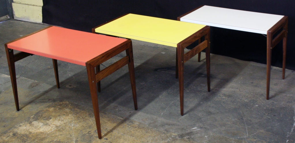 A Group of Three  Walnut Folding Tray Tables with Formica Tops
