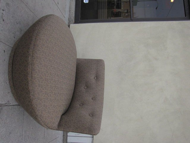 A Swivel Saucer Chair after Milo Baughman