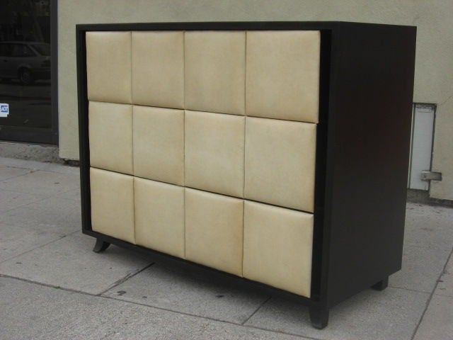 Iconic padded-naugahyde pair of dressers by Gilbert Rohde for Herman Miller in the late 30s.
They are made of ebonized mahogany and retain their original ivory color naugahyde.
It's very rare to find it in such a perfect condition and of course