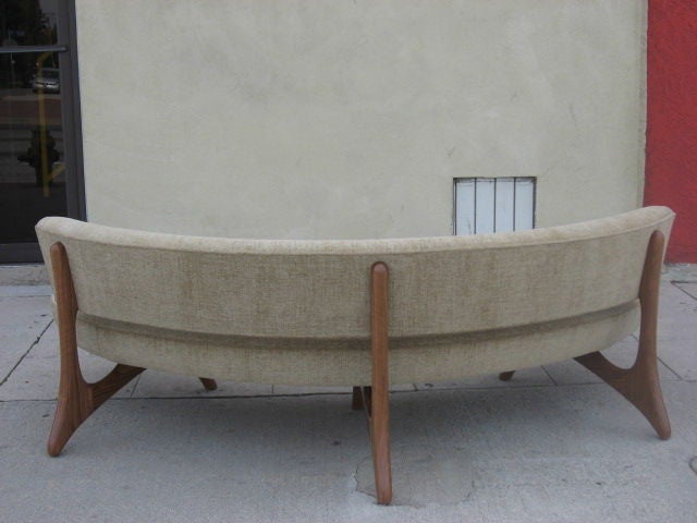 Walnut Floating Curved Sofa on Elegant Carved Base