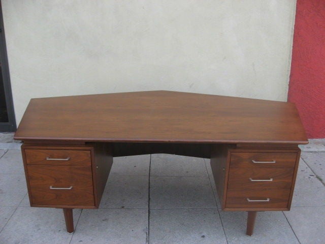 Comfortable desk with 4 regular drawers and 1 file drawer.
