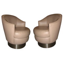 A Pair of Taupe Leather Swivel Chairs by Karl Springer