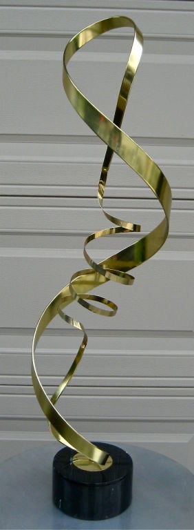 Brass Ribbon Table Sculpture on 6' round marble base by C.Jeré.