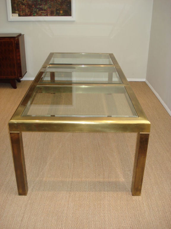 Grand  Brass and Glass Dining Table by Mastercraft.