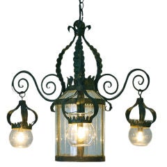 An Italian Wrought and Painted Iron and Metal 4-Light Lantern