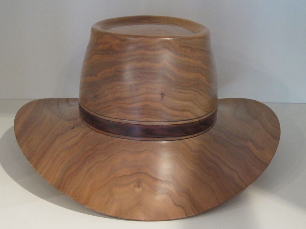 Incredibly carved Cowboy hat from renown artist Chris Ramsay.  These hats are carved from a single piece of wood as shown in image 4.  Ramsay has exhibited at the American Craft Council shows, and his work is collected througout America. Signed,