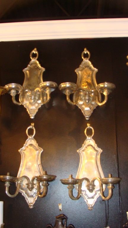 Set of circa 1930 silverplated sconces sold in sets of two.