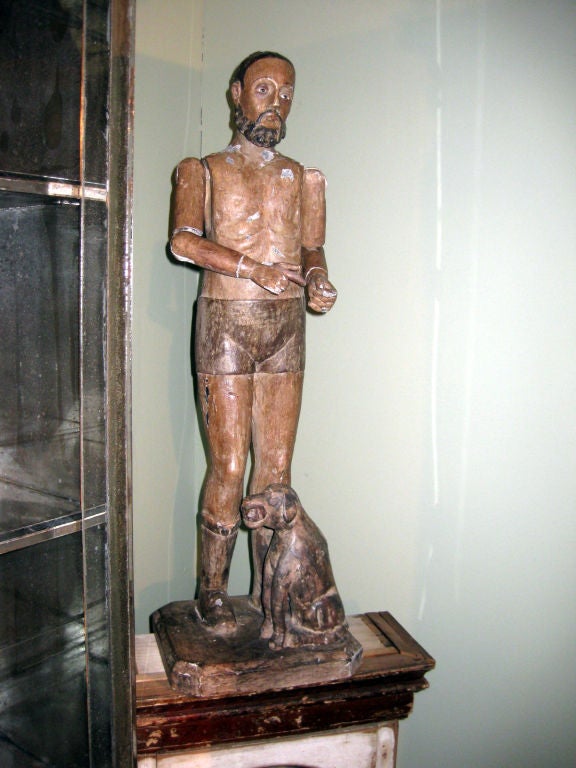 Carved figure of a man with dog