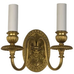 An antique sconce by maker E. F. Caldwell