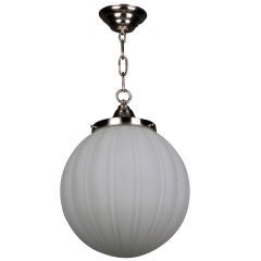 An antique frosted ribbed glass globe pendant