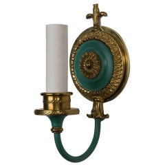 A pair of antique single arm green enameled sconces