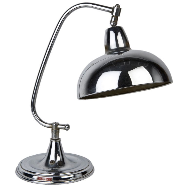 A vintage chrome dome-shaded desk lamp
