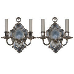 A pair of silverplate Caldwell sconces