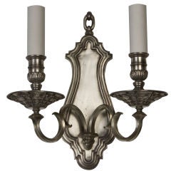 An antique double light silver sconce
