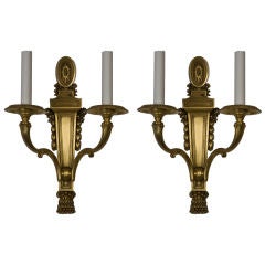 An antique gilded Caldwell sconce