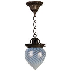 A hand-blown swirled opaline glass pendant