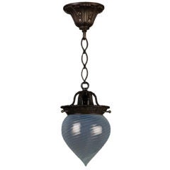 A hand-blown swirled opaline glass pendant