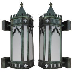 A pair of antique copper wall lanterns