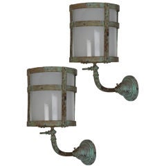 A pair of antique cylindrical wall lanterns