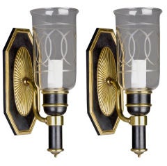 A pair of Antique black and gold hurricane sconces