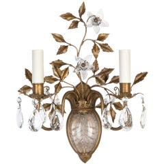 A double-light antique sconce with prisms