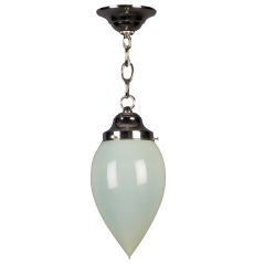 An antique teardrop-shaped hand-blown glass pendantC