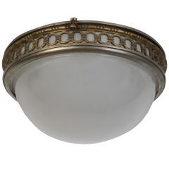 An antique nickel and bronze flushmount fixture