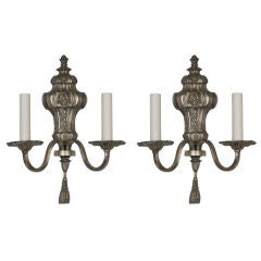 An antique pair of Baroque nickeled bronze sconces