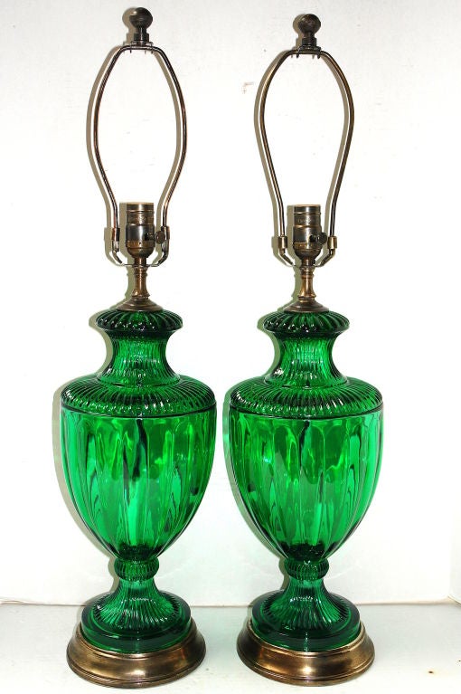 A pair of circa 1940's French green molded glass urn shaped table lamps with patinated bronze bases.

Measurements:
Height of body: 18