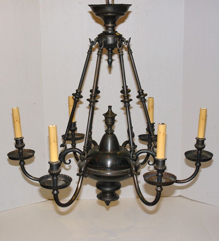 A circa 1920 Dutch patinated bronze chandelier with original patina and supported by rods. 6 Lights.
