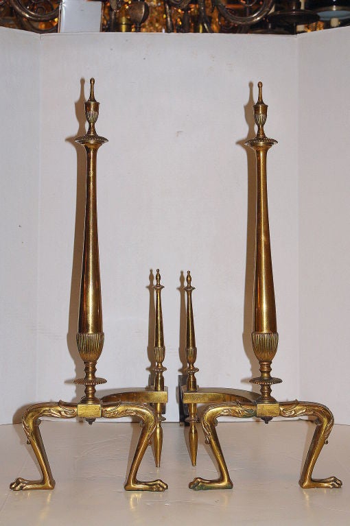 Pair of circa 1900 English neoclassic style bronze andirons.

Measurements:
Height: 29