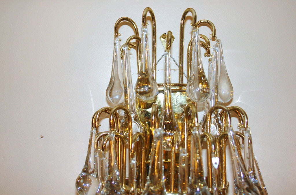 A set of 4 Italian 1950's sconces with oversized glass drops, 3 edison interior lights and original gilt finish.

Measurements:
Height: 28