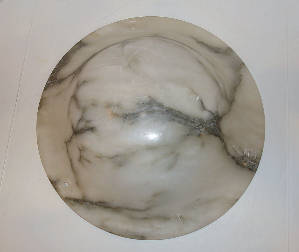 A circa 1920's carved Italian alabaster light fixture with interior lights & to be fitted with 3 bronze chains.
Measurements:
Diameter: 19.75