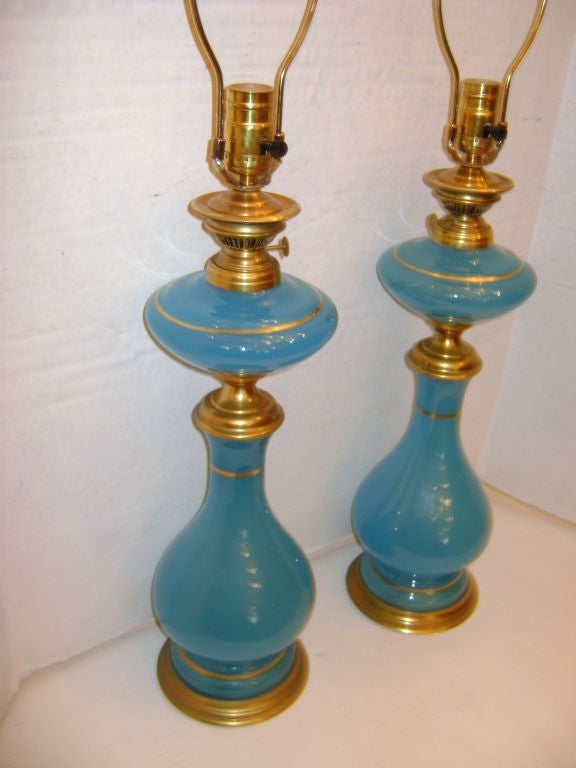 Pair of 1920s French opaline glass table lamps with gilt details. 18.5