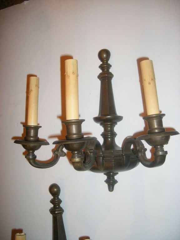 Pair of three lights American patinated bronze sconces.

Measure: 13.5
