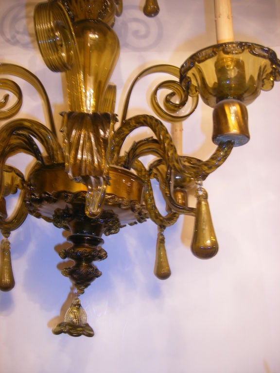 A circa 1920's pale green Venetian blown glass chandelier with leaf and flower motif. 4 lights.

Measurements:
Height: 28