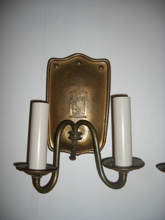 Pair of Arts and Crafts English patinated bronze 2 light sconces with bird motif on backplate.<br />
11
