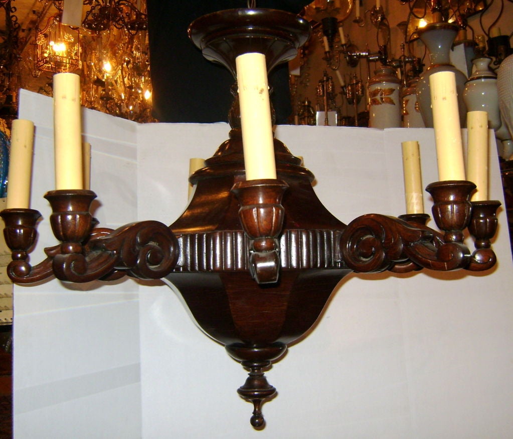 A circa 1900 Italian carved wood chandelier.

Measurements
Height: 32